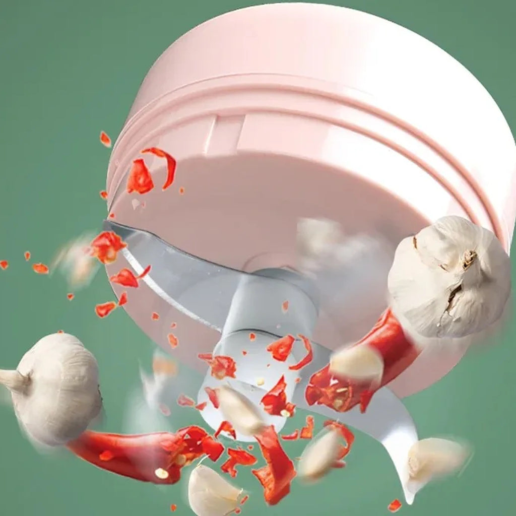Mini tritatutto portatile senza fili rosa con contenitore trasparente